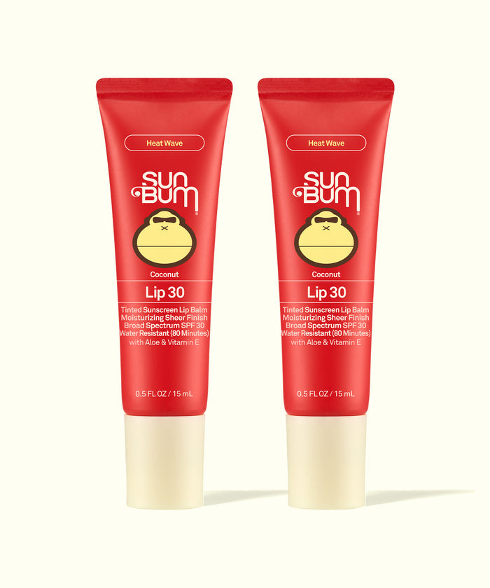 Two Sun Bum Heat Wave tinted lip balms in red tubes with beige caps shown side by side for Tinted Lip Duos.