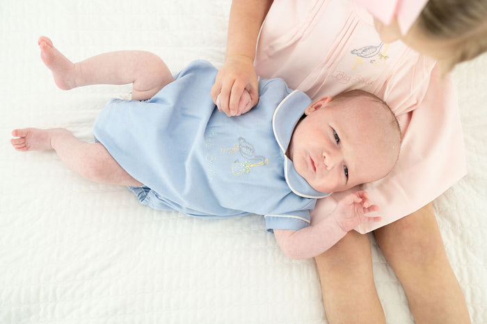 A baby boy wearing the Baby Brother Stork Bubble will melt hearts at every special moment.