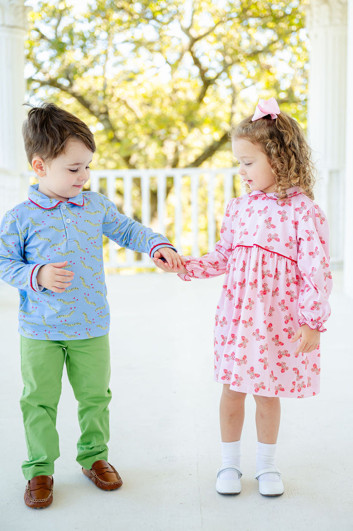 A little girl in the Butterfly Heart Dress and a little boy look absolutely charming together, with the dress combining comfort and whimsical style.
