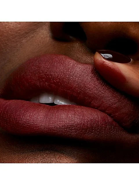 M.A.C Powder Kiss Lipstick in various shades, new in box, showcasing vibrant color and sleek packaging for a beauty product.