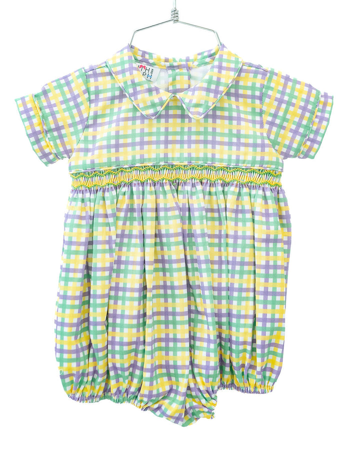 The Mardi Gras bubble features a classic green, yellow, and purple plaid with detailed smocking across the chest.