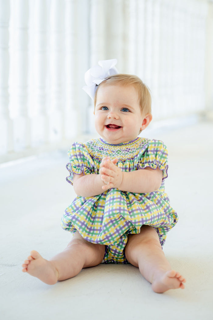 This smocked Mardi Gras bubble is designed with elegance and comfort, perfect for celebrating the season in style.