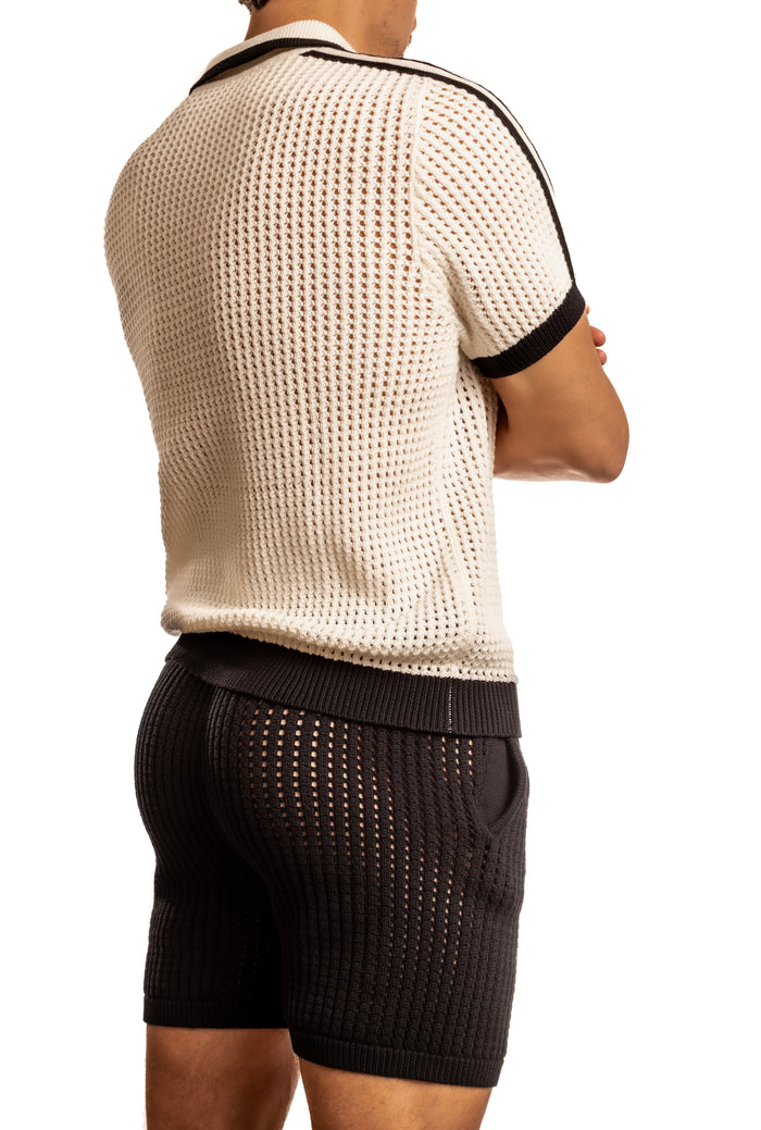 Man standing wearing a pair of Jack Adams white Matteo Crochet Knit Pull Over Shirt (back view) on a white background.