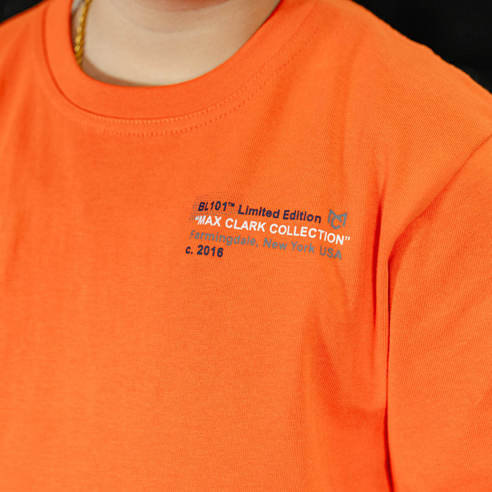 Orange shirt with text and logo, brand name 'MAX CLARK COLLECTION' visible