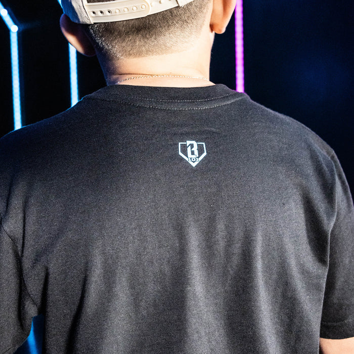 Youth model wearing black youth graphic tee with "Miami Marlins Upside Down" design