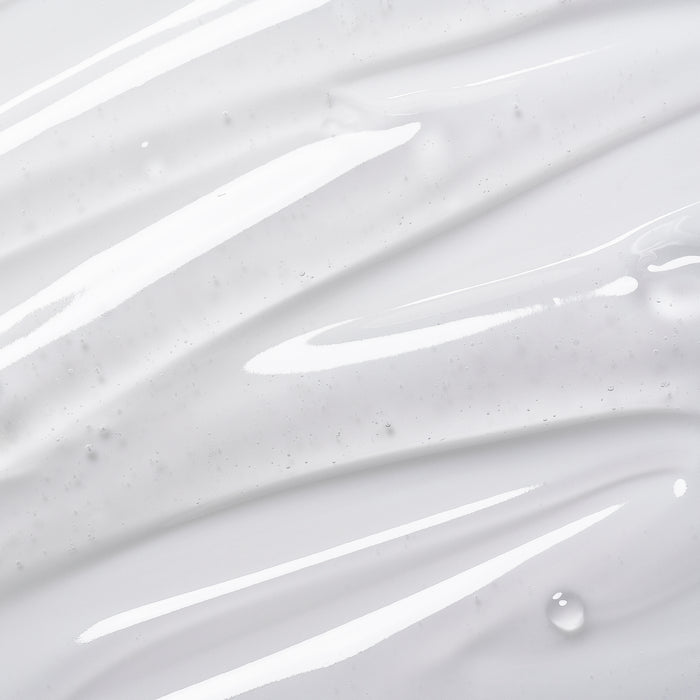 Smooth white skincare cream swatch with dewy texture and fine bubbles, showcasing lightweight hydration for all skin types