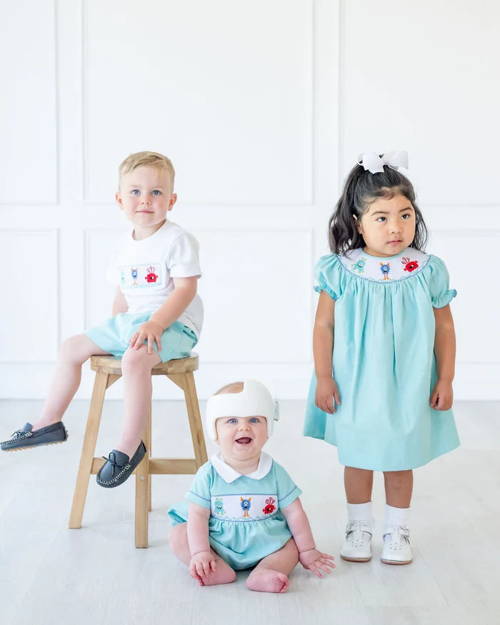 CHILDREN WEARING SMOCKED MONSTERS OUTFITS