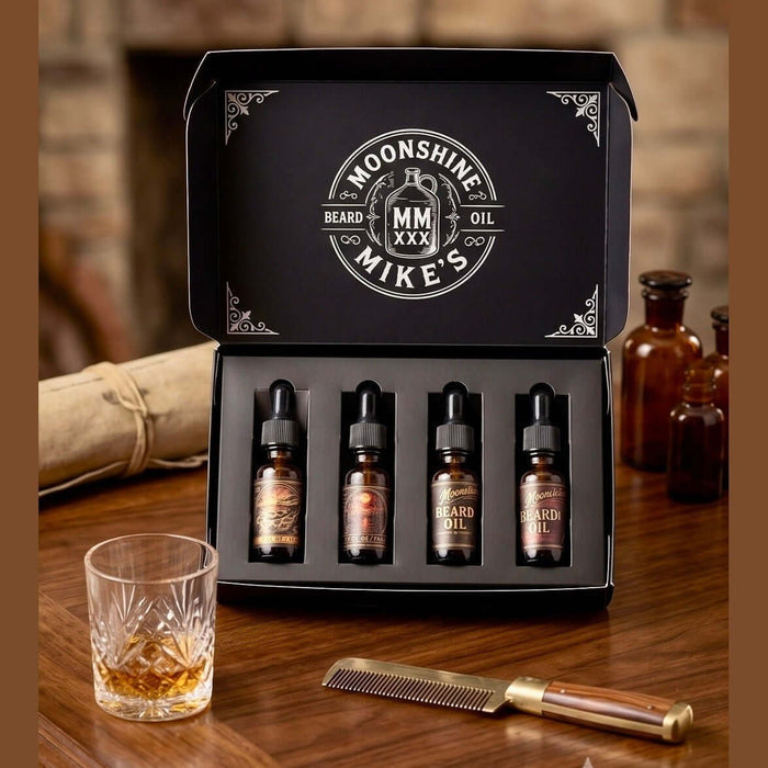 Fort Denaud Beard and Skin Moonshine Mike's beard oil gift set with four amber dropper bottles in a black display box.