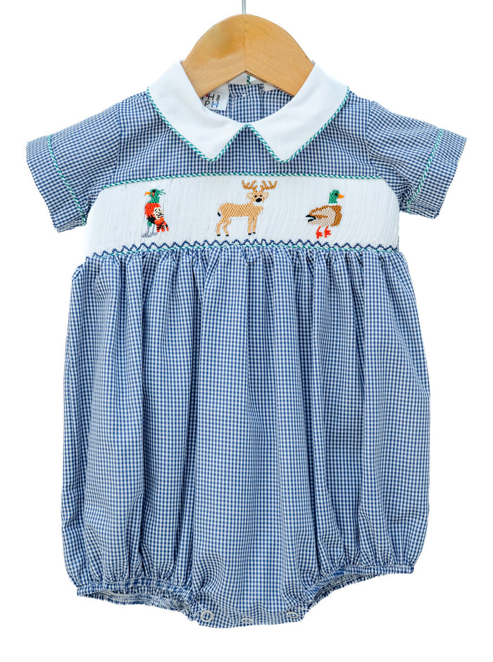 Smocked Hunting Bubble for Boys by Ruth and Ralph, blue gingham with peter pan collar and smocked deer and duck embroidery, on hanger