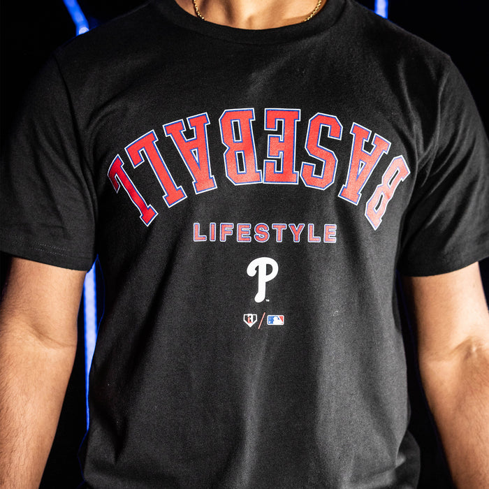 Youth model wearing black youth graphic tee with "Philadelphia Phillies Upside Down" design