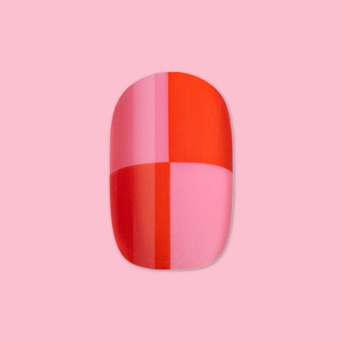 Pink Checker Party | Short | Round - Tab Press-On featuring a bold pink and red checker pattern on single false nail against soft pink background