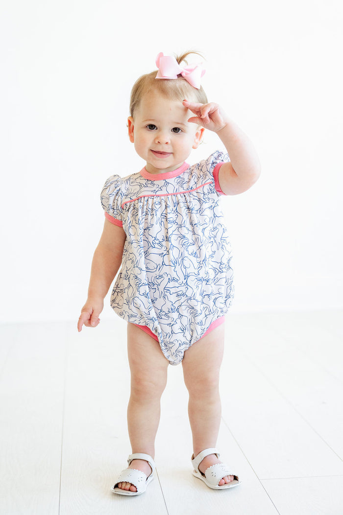 The Playful Bunnies Pima Hallie Bubble runs true to size (TTS), but may shrink if dried in the dryer, ensuring the best fit after washing.