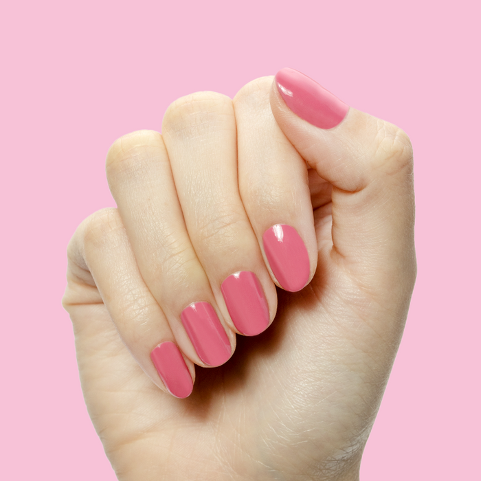 Prom - Gel shown on nails in a bold magenta pink shade for a vibrant, long-lasting at-home manicure by Olive and June