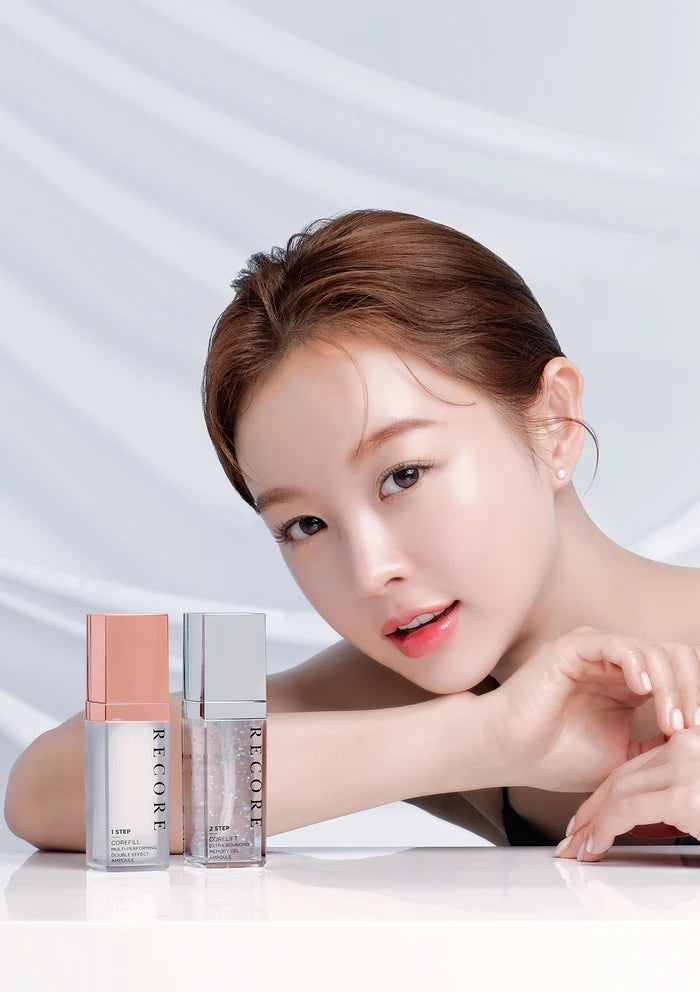 Woman with skincare products on a white background