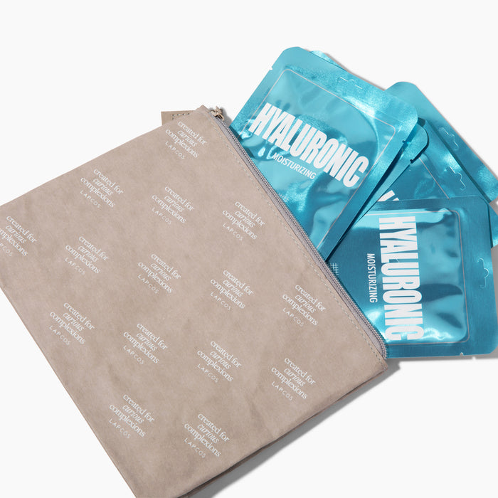 Blue hyaluronic acid face masks on a beige lapcos makeup bag with text.