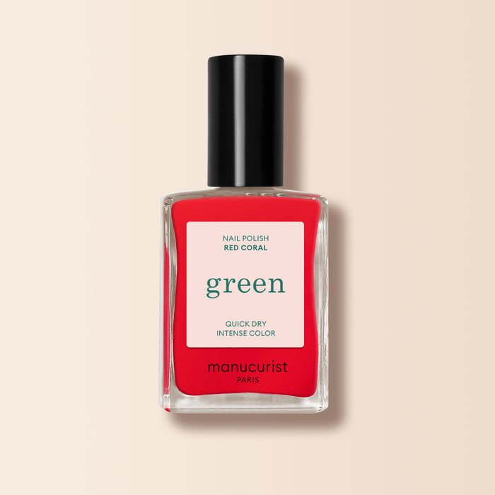 Manucurist Red Coral nail polish in a festive coral red shade, featuring a black cap and clear rectangular bottle with a cream label from the Green™ range.