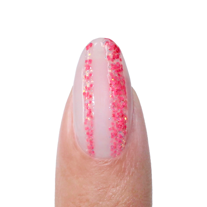 Rose Burst liner used for a pink glitter vertical stripe on a sheer nude nail