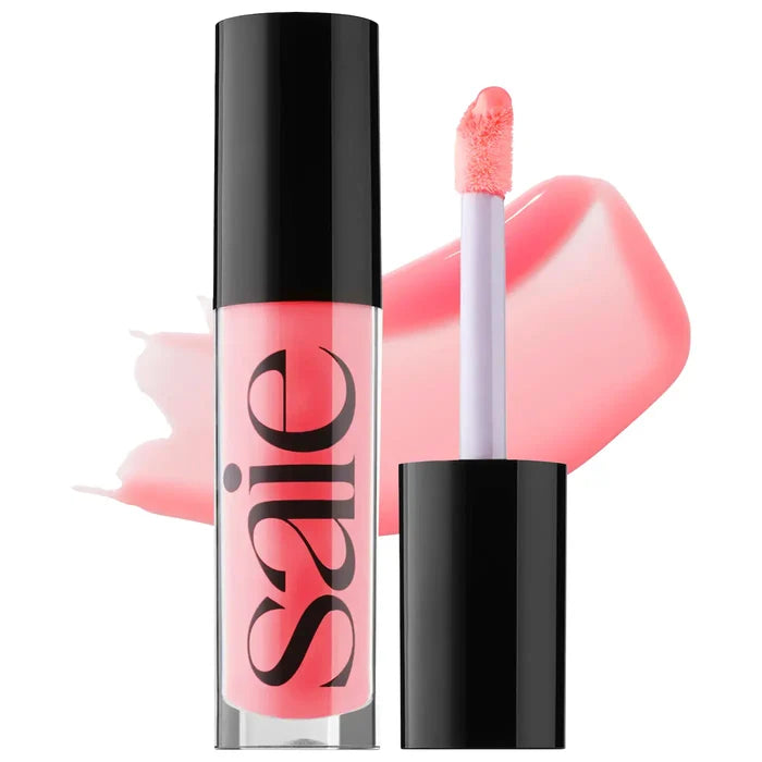 Saie Glossybounce™ high-shine hydrating lip gloss oil in multiple shades, featuring a glossy finish and smooth applicator brush.
