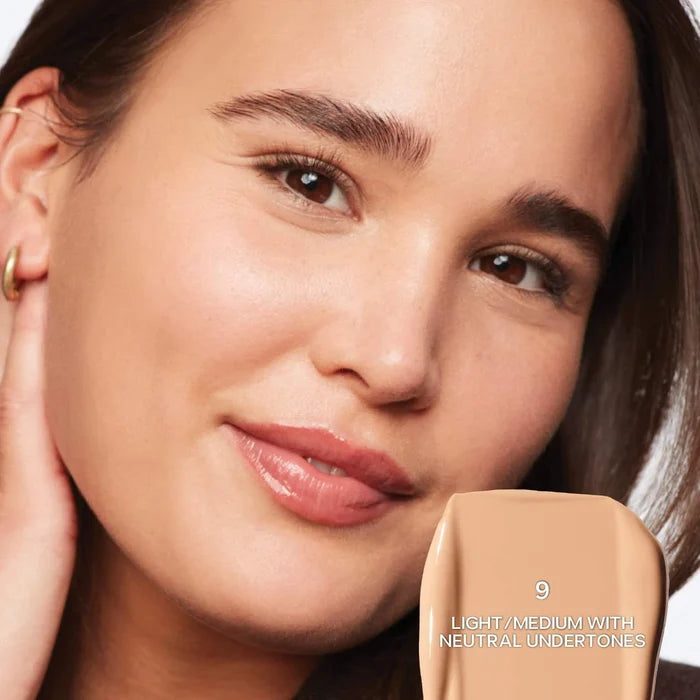 Saie Slip Tint Radiant All-Over Concealer in various shades, displayed with a smooth, natural finish and sleek packaging.