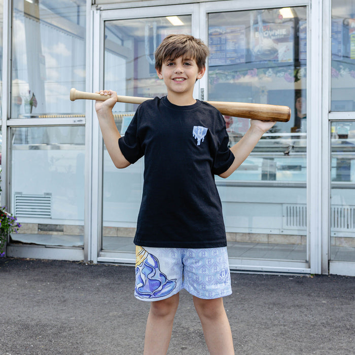 Youth model wearing youth graphic tee with "Scoop SZN" design