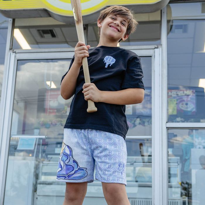 Youth model wearing youth graphic tee with "Scoop SZN" design