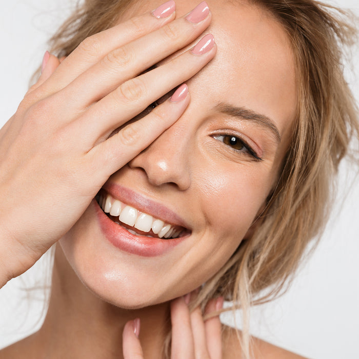Radiant skin and healthy smile with glowing complexion, soft touch, and natural makeup look for all skin types