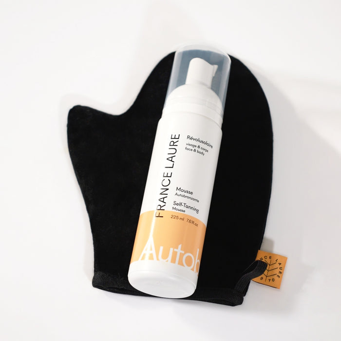 France Laure self-tanning mousse for face & body with black application mitt, 225ml bottle on white background