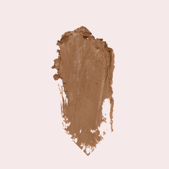 Macro texture shot of 'Latte' Soft Matte Contour Stick formula on skin — soft-matte finish, no harsh lines, buildable contour.
