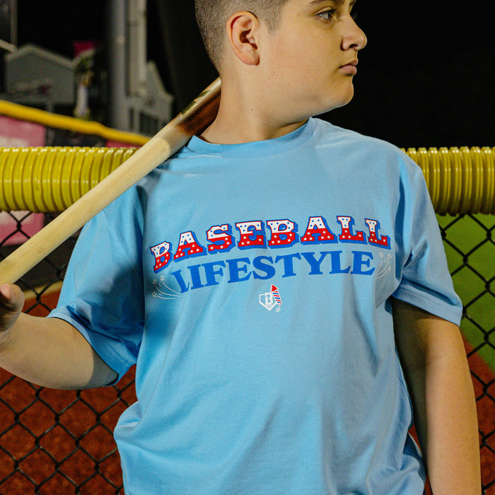Light blue tee with patriotic red, white, and  blue Baseball Lifestyle graphic, 4th of July