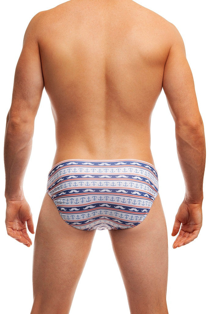 Man standing wearing a pair of Jack Adams blue/white Stash and Anchor Swim Brief (back view) on a white background.