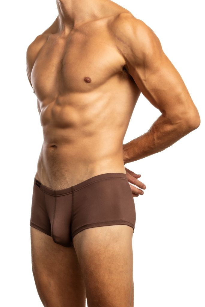 Shirtless man standing in front of a white background wearing a pair of Jack Adams Modal Streamlined Boxer in chicory (profile view)