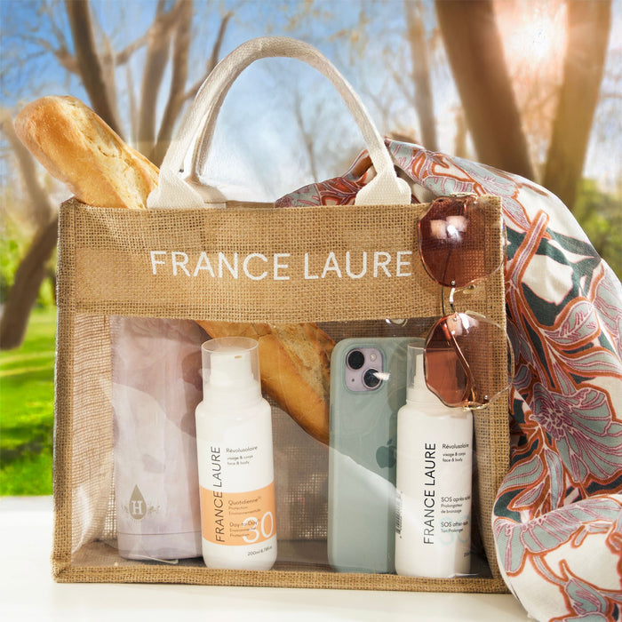 France Laure sun care essentials in a picnic tote: SPF 30 daily protection & after-sun lotion, perfect for face and body outdoors.