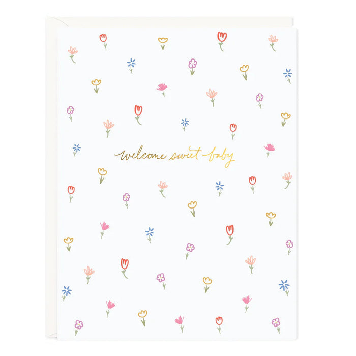 Floral baby blanket with colorful tulip icons and "welcome sweet baby" print