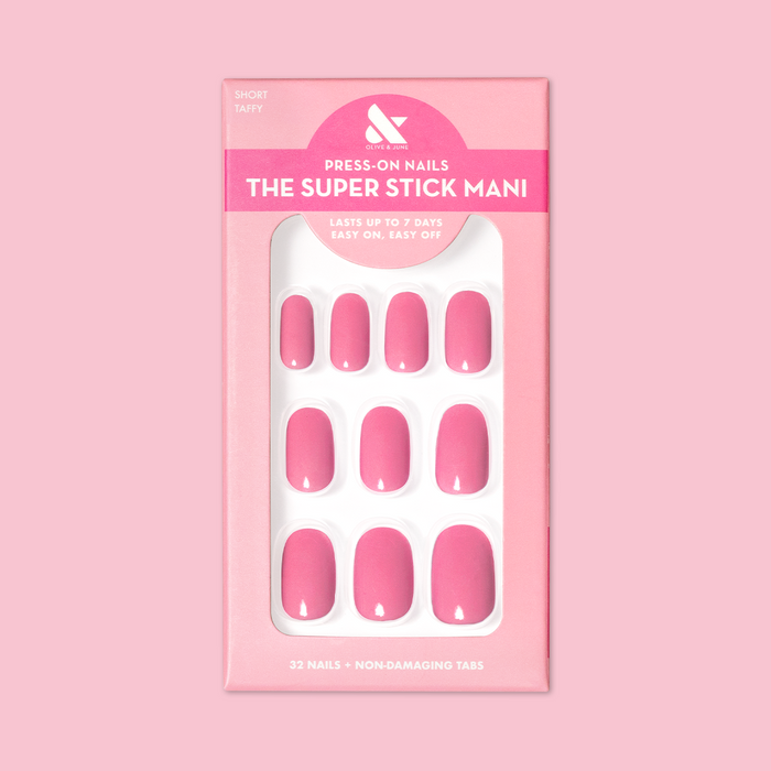 Taffy | Short | Round - Tab Press-On showing bright hot pink glossy press-on nails in packaging on pink background