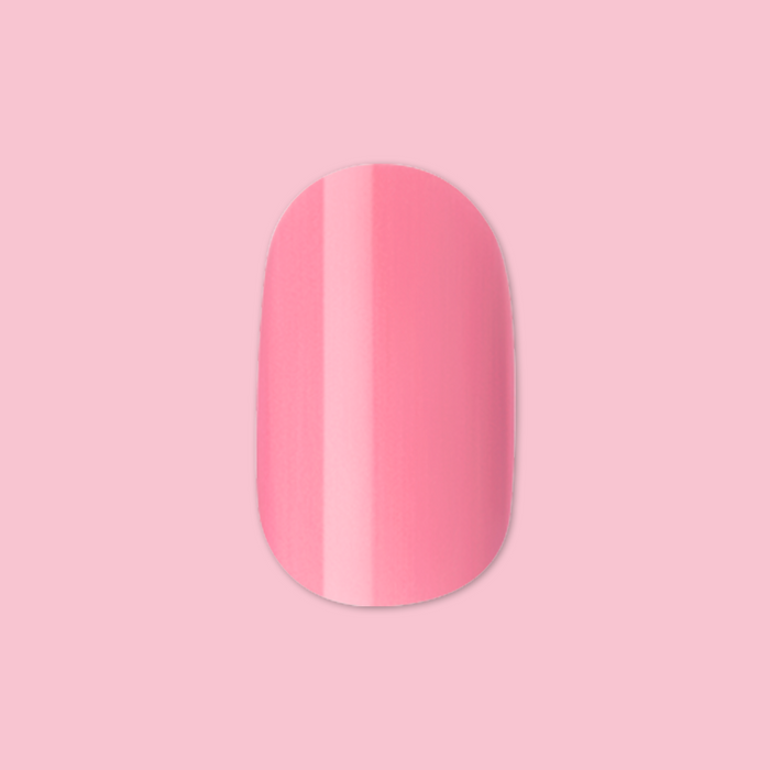 Taffy | Short | Round - Tab Press-On showing glossy sugary sweet pink false nail on a light pink background