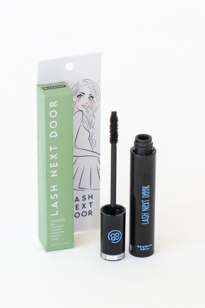 Mascara with packaging and brush on a white background
