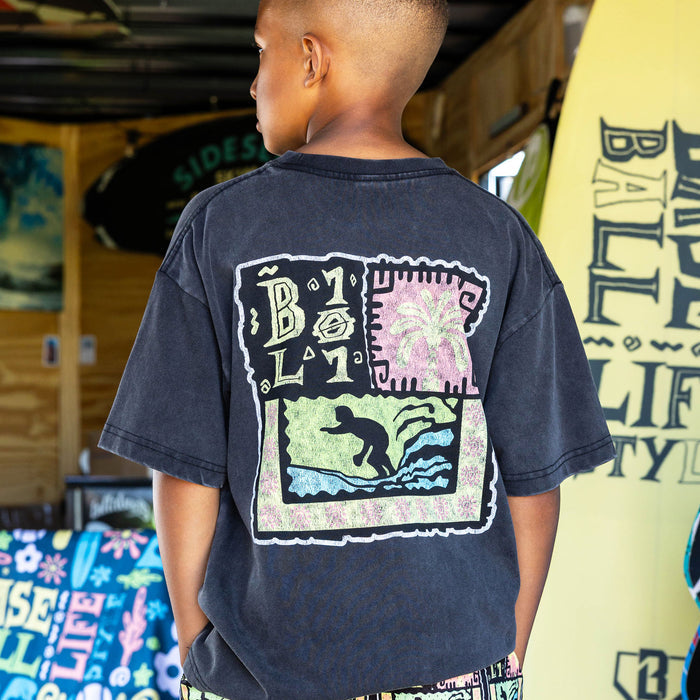 Youth model wearing black youth graphic tee with "Wave Goodbye" design