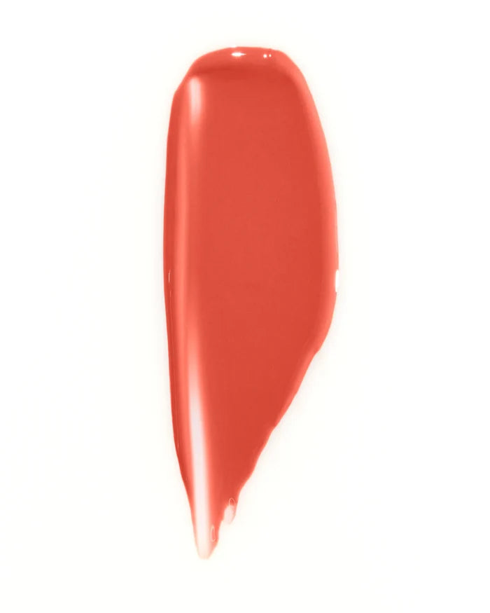 WONDERBLUSH La Laque Tinted Lip Oil in Abricot, swatched on skin showing its soft peachy-orange hue and glossy finish.